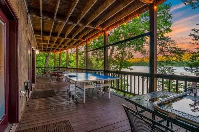 Covered deck with ping pong table at twilight, Parsons Shores Lodge, Norris Lake, Sharps Chapel TN